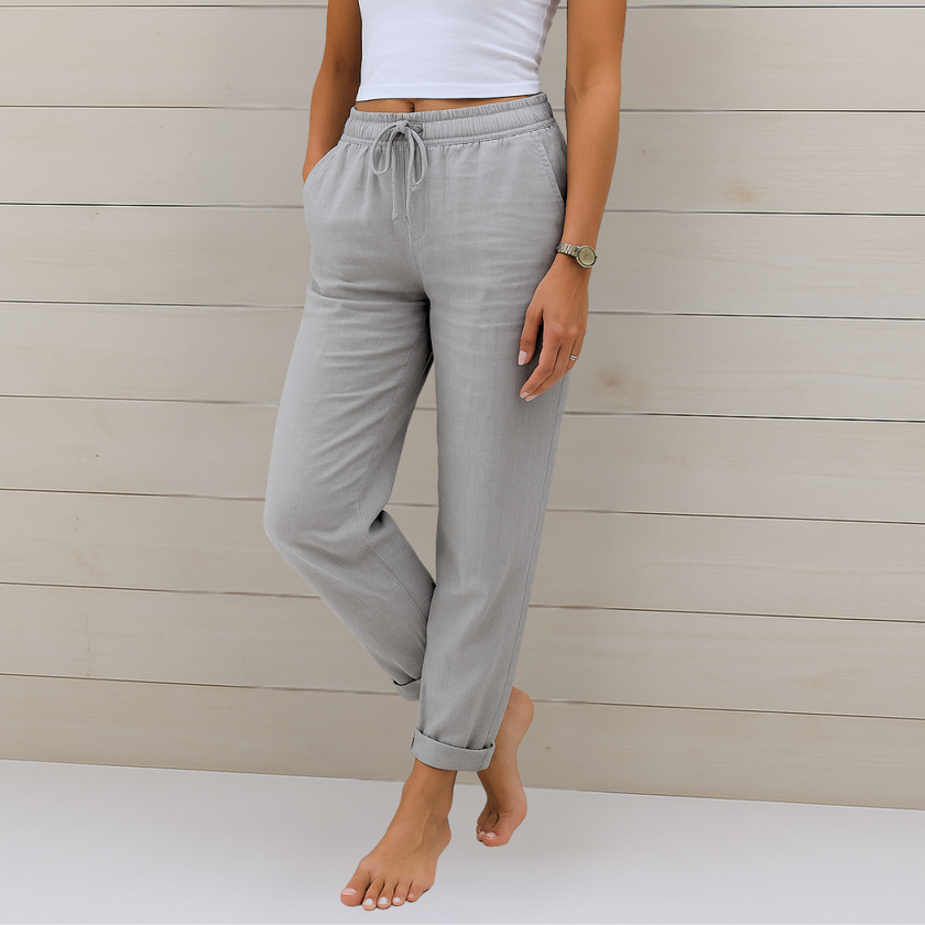 FJØRNA lightweight summer women's trousers with elastic waist, breathable fabric, and relaxed fit for casual wear.