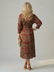 FJØRNA women's summer midi dress with long sleeves, wrap style, flowy fabric, perfect for warm weather and casual occasions.