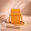 FJØRNA touchscreen crossbody bag for women with phone compartment, black bag with adjustable strap and sleek design.