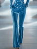 Blue loose velvet flared women's trousers from FJØRNA, showing the relaxed fit and soft fabric details.