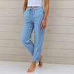 FJØRNA lightweight summer trousers for women with elastic waistband, breathable fabric, and relaxed fit.