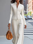 White stand collar zip-up wide-leg pants suit for women by FJØRNA, featuring a tailored fit and stylish design.