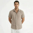 Men's cotton-linen short sleeve shirt by FJØRNA, shown in a relaxed fit with a classic collar and natural fabric texture.