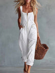 Light yellow denim jumpsuit for women with square neckline and front zipper, by FJØRNA, shown on a model.