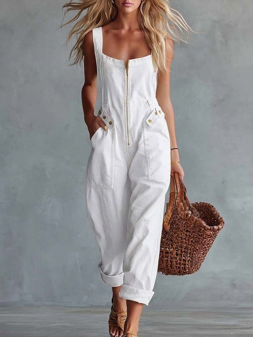 Light yellow denim jumpsuit for women with square neckline and front zipper, by FJØRNA, shown on a model.