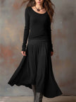 Charcoal knit maxi dress for women by FJØRNA, featuring a flowing silhouette and long length, perfect for casual or elegant wear.