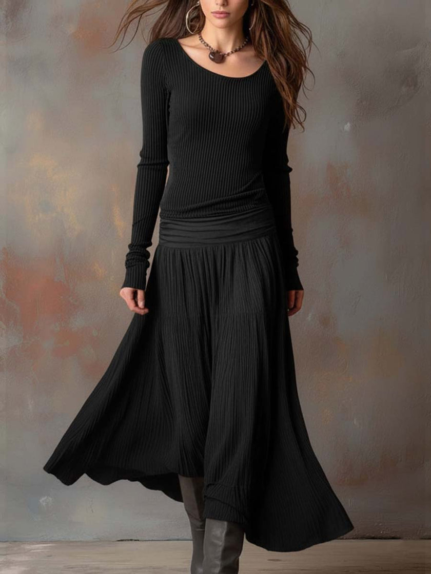 Charcoal knit maxi dress for women by FJØRNA, featuring a flowing silhouette and long length, perfect for casual or elegant wear.