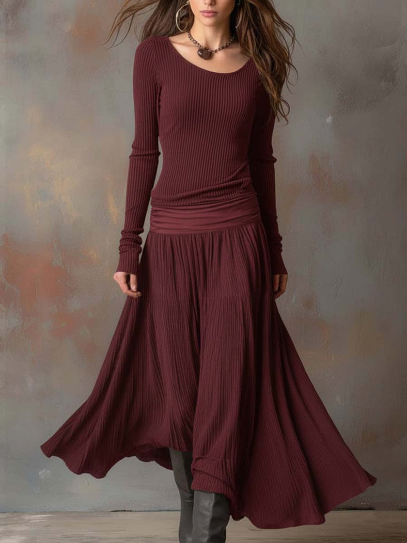 Charcoal knit maxi dress for women by FJØRNA, featuring a flowing silhouette and cozy knit fabric.