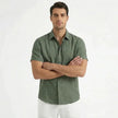 Men's cotton-linen short sleeve shirt by FJØRNA, shown in a relaxed fit with a button-up front and casual collar.
