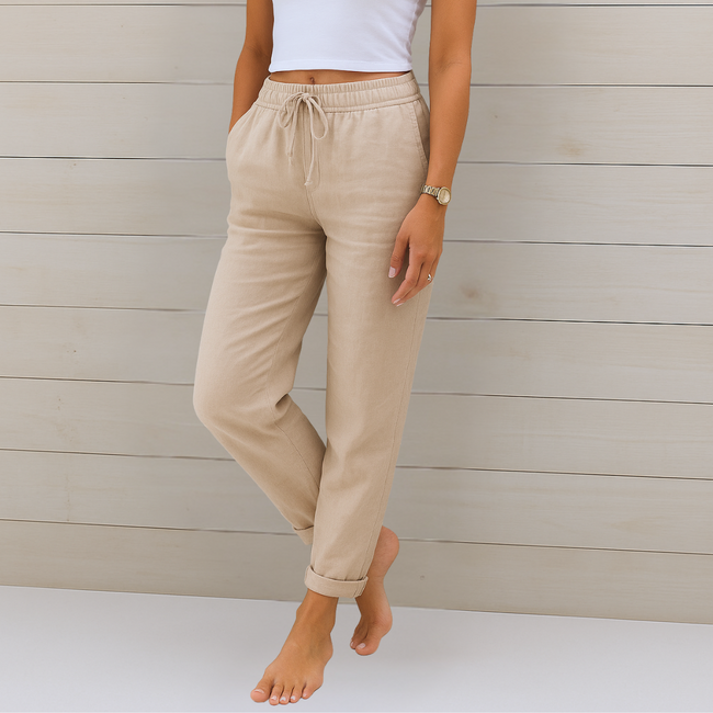 FJØRNA women's lightweight summer trousers with elastic waist, breathable fabric, and relaxed fit for casual wear.