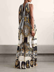 FJØRNA women's maxi dress with vibrant retro pattern print, perfect for summer, flowing fabric, and elegant style.