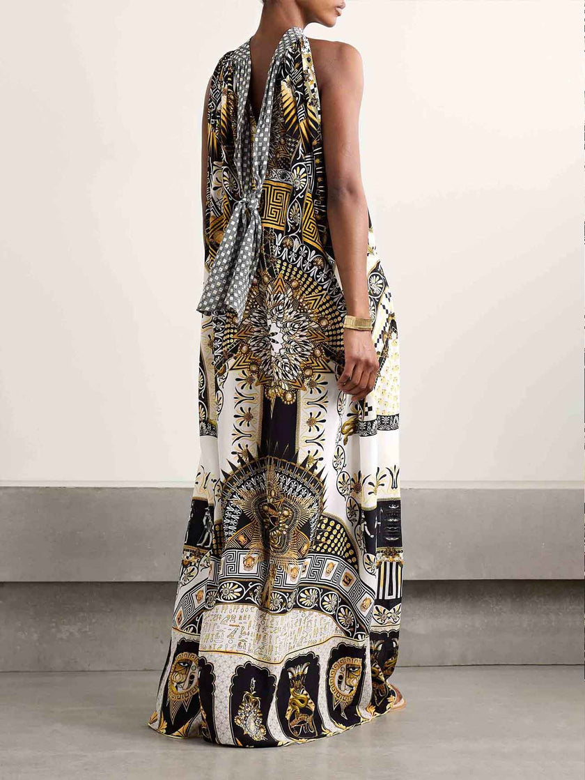 FJØRNA women's maxi dress with vibrant retro pattern print, perfect for summer, flowing fabric, and elegant style.