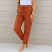 FJØRNA lightweight summer women's trousers with elastic waist, breathable fabric, and a relaxed fit, perfect for warm weather.