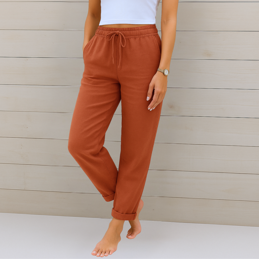 FJØRNA lightweight summer women's trousers with elastic waist, breathable fabric, and a relaxed fit, perfect for warm weather.