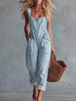 Light yellow denim jumpsuit for women with square neckline and zip-front, by FJØRNA, featuring stylish pant design.