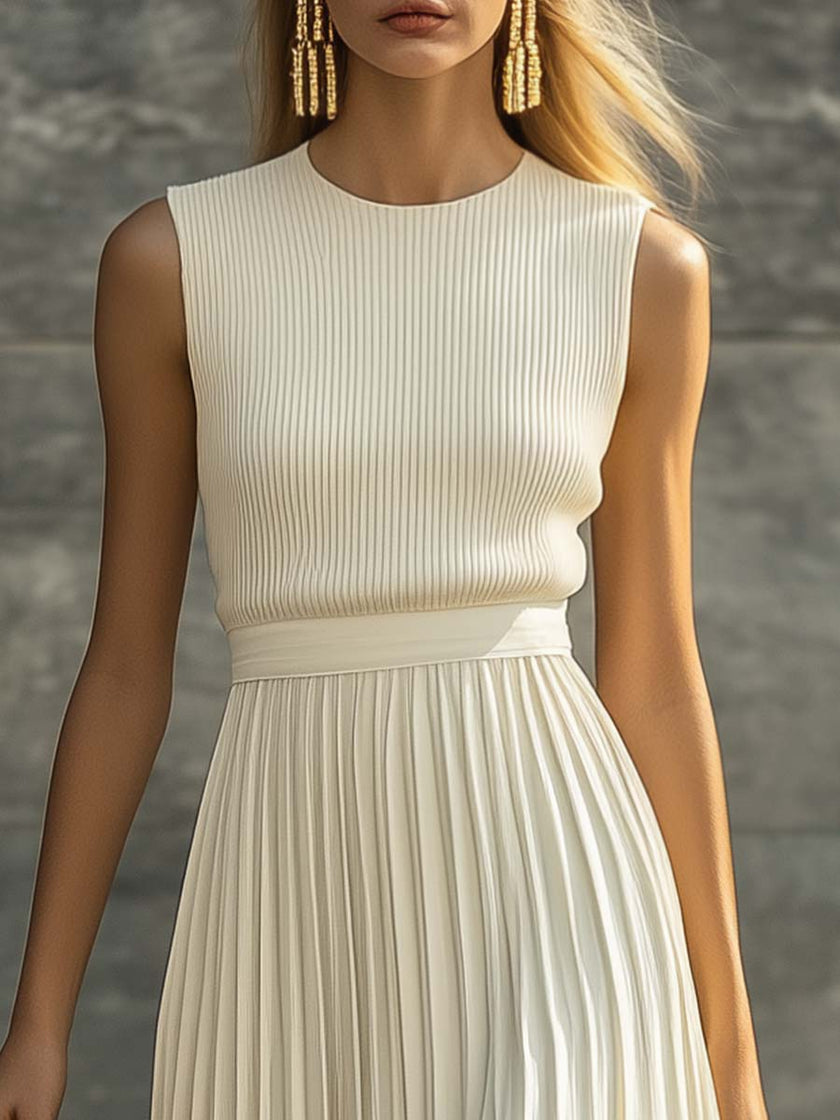 FJØRNA cream chiffon pleated maxi dress featuring a flowy, elegant design ideal for casual occasions.