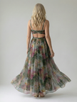 Flowy sleeveless summer maxi dress for women by FJØRNA, lightweight and perfect for warm weather, shown on a model.