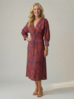FJØRNA women's summer midi dress with long sleeves and wrap design, shown in a flowing fabric on a model.