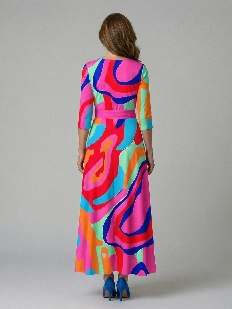 FJØRNA women's floral summer maxi dress with V-neck and wrap style, featuring a flowing silhouette and vibrant print.
