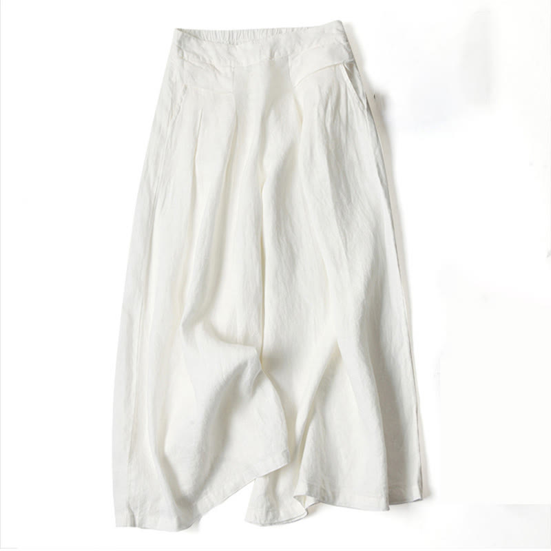 FJØRNA lightweight summer women's trousers with wide leg, high waist, and side pockets, perfect for casual warm-weather wear.