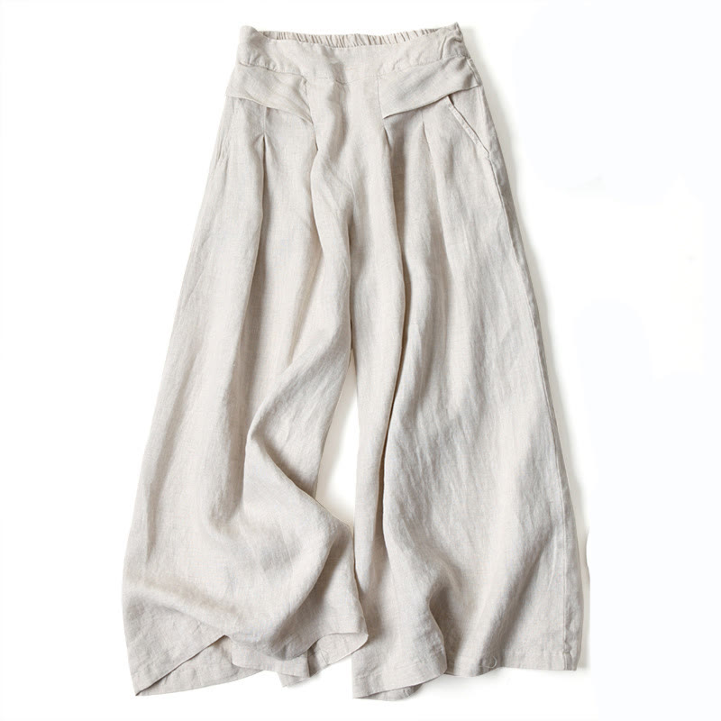 FJØRNA women's lightweight summer trousers with wide legs, high waist, and front pockets, perfect for casual warm-weather wear.
