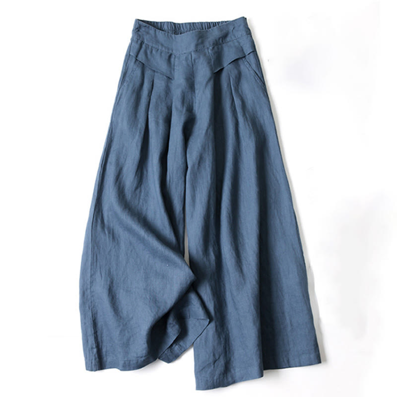 FJØRNA lightweight summer women's trousers with wide legs, high waist, and side pockets, made from soft, breathable fabric.