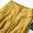 FJØRNA women's lightweight summer trousers with wide legs, high waist, and side pockets, perfect for warm weather casual wear.