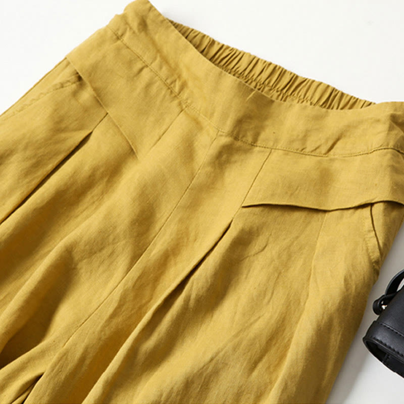 FJØRNA women's lightweight summer trousers with wide legs, high waist, and side pockets, perfect for warm weather casual wear.
