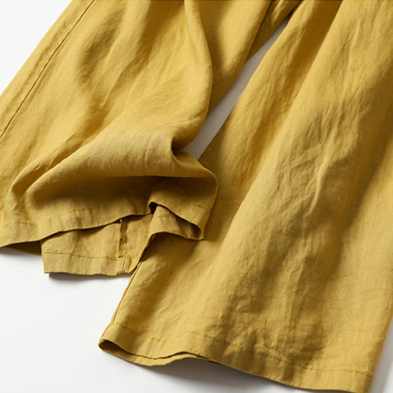 FJØRNA women's lightweight summer trousers with wide leg, high waist, and side pockets, made of breathable fabric.