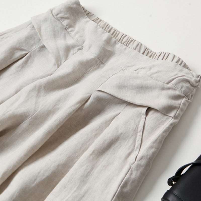 FJØRNA women's lightweight summer trousers with wide legs, high waist, and pockets, suitable for casual warm-weather wear.