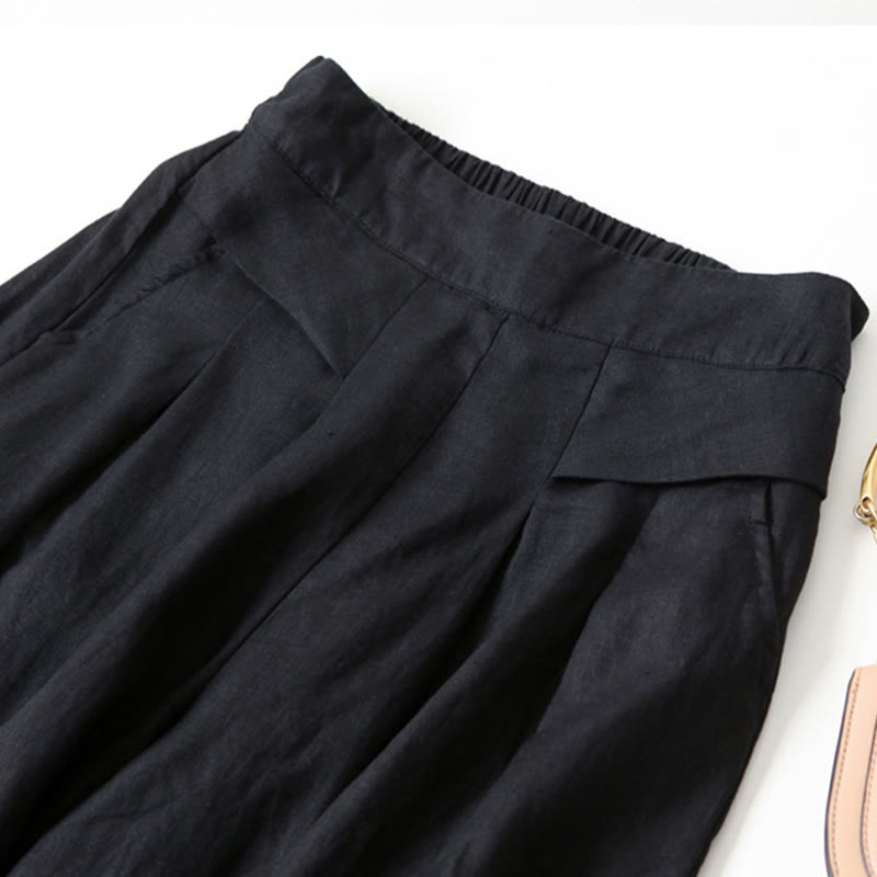 FJØRNA women's lightweight summer trousers with wide legs, high waist, and front pockets, perfect for warm-weather casual wear.