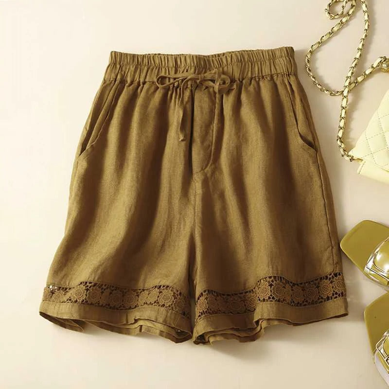 FJØRNA lightweight women's summer shorts with elastic waist and floral pattern, perfect for casual warm-weather wear.
