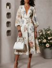 Ivory chiffon midi dress for women with V-neck and printed design by FJØRNA, showcasing a flowy, elegant style.