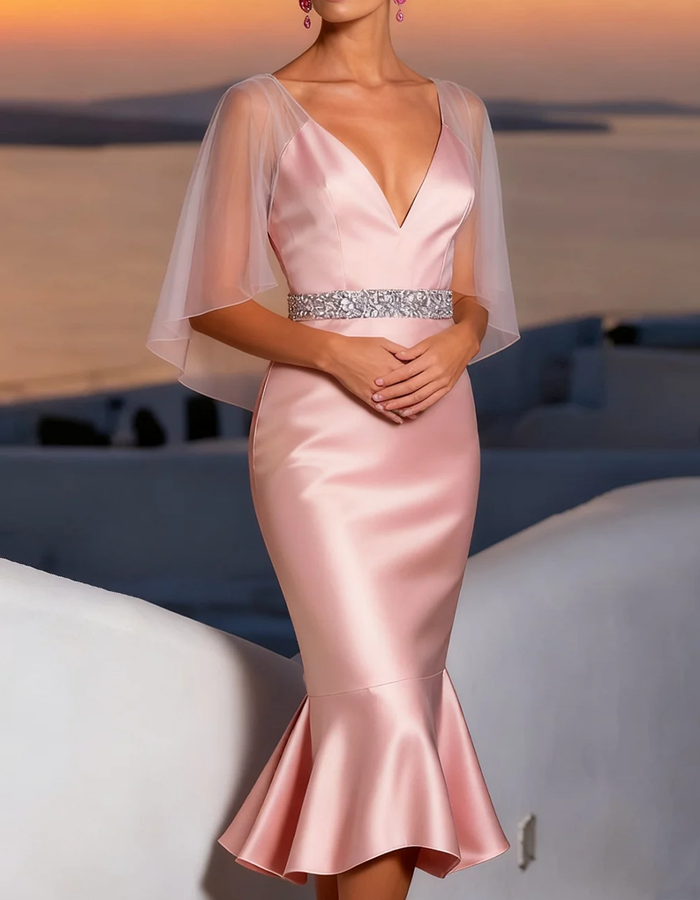 Pale pink satin midi dress for women featuring a mermaid silhouette and shawl, by FJØRNA, showcased on a hanger.