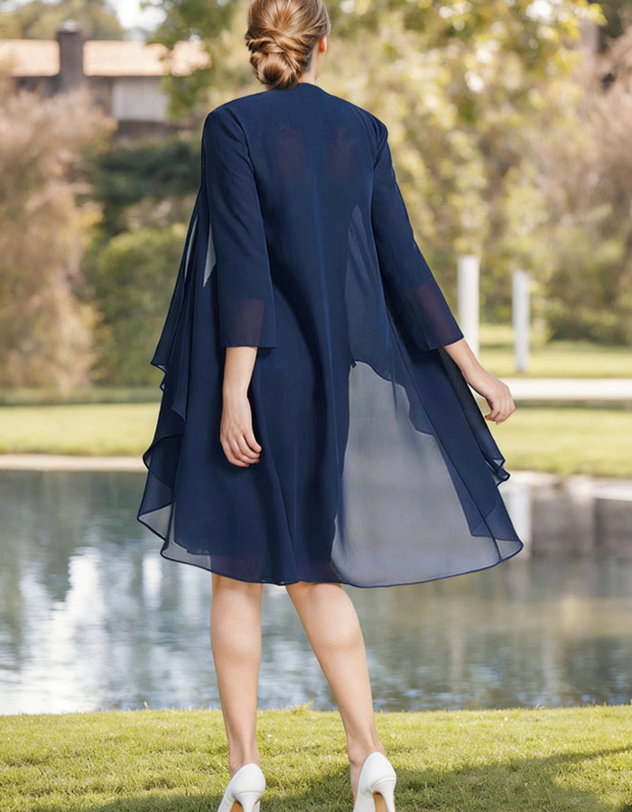 Navy blue tulle midi dress for women by FJØRNA, featuring pleated two-piece set with flowing skirt and elegant design.
