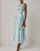 Light blue chiffon midi dress for women with one-shoulder floral design by FJØRNA, featuring elegant flowing fabric.