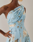Light blue chiffon midi dress for women by FJØRNA, one-shoulder floral design, elegant and flowy for special occasions.