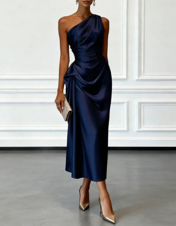 FJØRNA champagne satin midi dress for women with one-shoulder design and pleated details, elegant evening wear.
