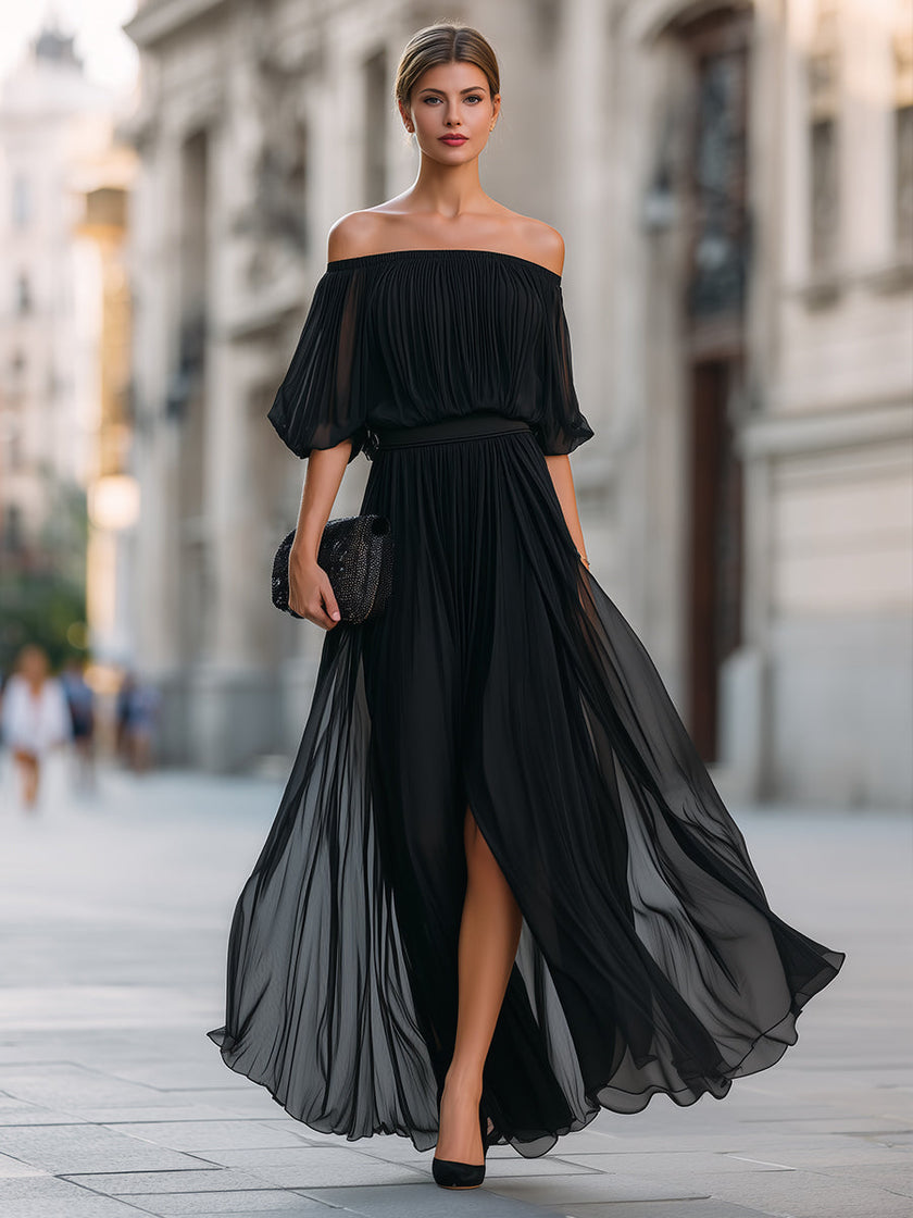 FJØRNA off-shoulder pleated chiffon maxi dress for wedding guests, featuring a flowing design and elegant off-shoulder style.