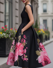 Black floral printed sleeveless midi dress for women by FJØRNA, shown with a fitted waist and flowing skirt.