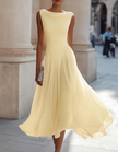 FJØRNA chiffon midi dress for women with draped neckline and pleated design, elegant and flowy for special occasions.