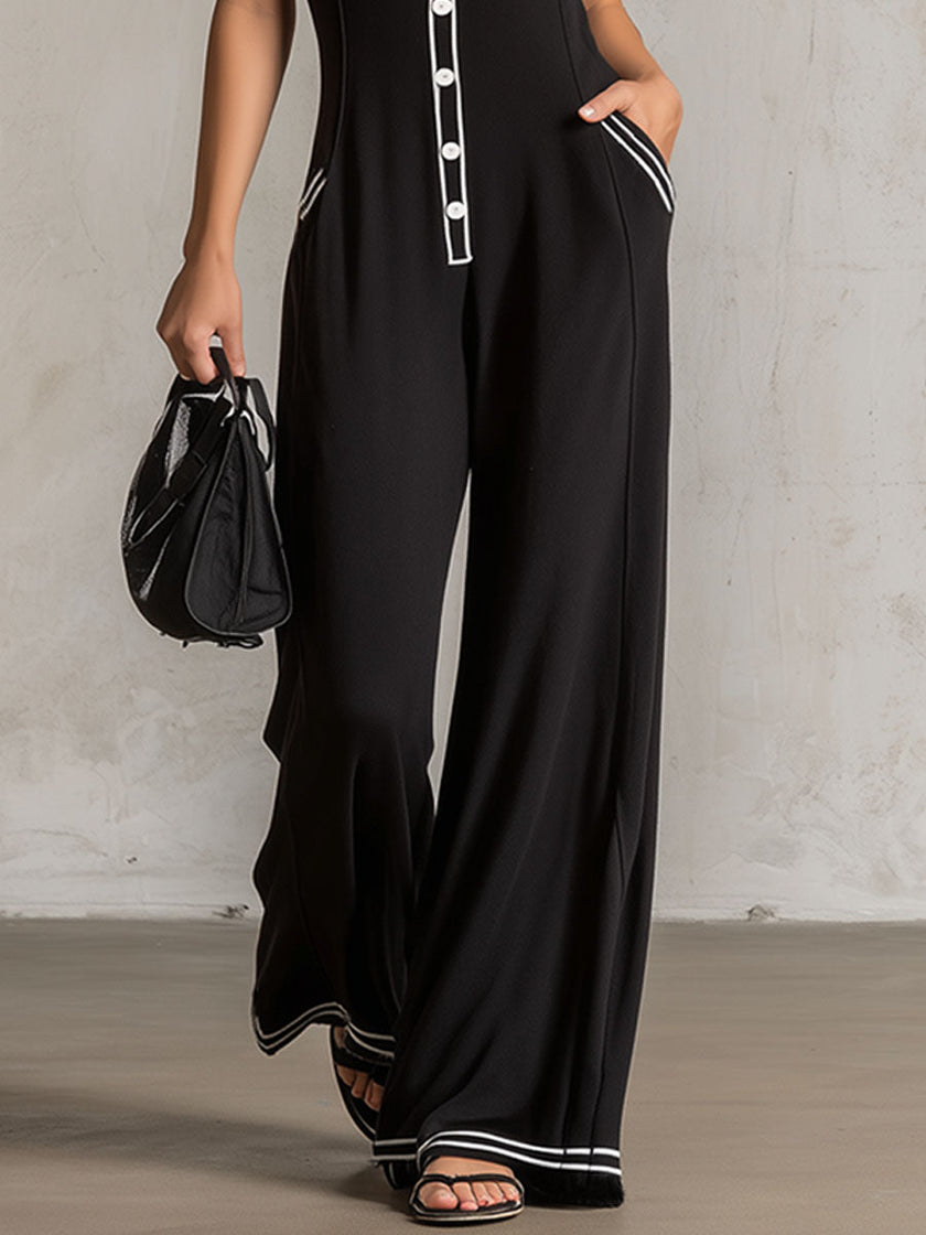 FJØRNA black color-block V-neck sleeveless jumpsuit with button-down front and wide-leg pants for women.