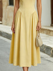 Yellow off-the-shoulder sweetheart A-line midi dress by FJØRNA, featuring a fitted bodice and flowing skirt.