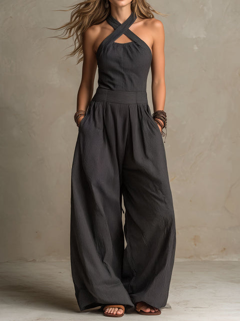 FJØRNA women's charcoal pinstripe halter neck wide-leg jumpsuit, stylish pants with a halter top and relaxed fit.