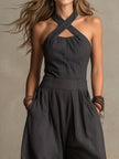 FJØRNA charcoal pinstripe halter neck wide-leg jumpsuit for women, showing the stylish halter top and flowing wide-leg pants.