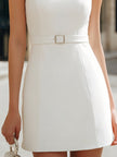 White sheer mesh mini dress by FJØRNA featuring pearl-embellished yoke and belt, showcasing elegant, fitted bodycon style.