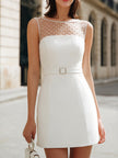 White sheer mesh bodycon mini dress with pearl-embellished yoke and belt detail by FJØRNA, shown on a model.