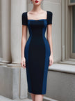 FJØRNA colorblock panel sleeveless structured midi dress with bold color blocks and tailored fit, displayed on a hanger.