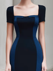FJØRNA colorblock panel sleeveless structured midi dress with fitted waist and bold color accents, perfect for stylish occasions.