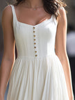 FJØRNA square-neck button-front gathered midi dress with long sleeves and a fitted waist, in a stylish, flowy silhouette.